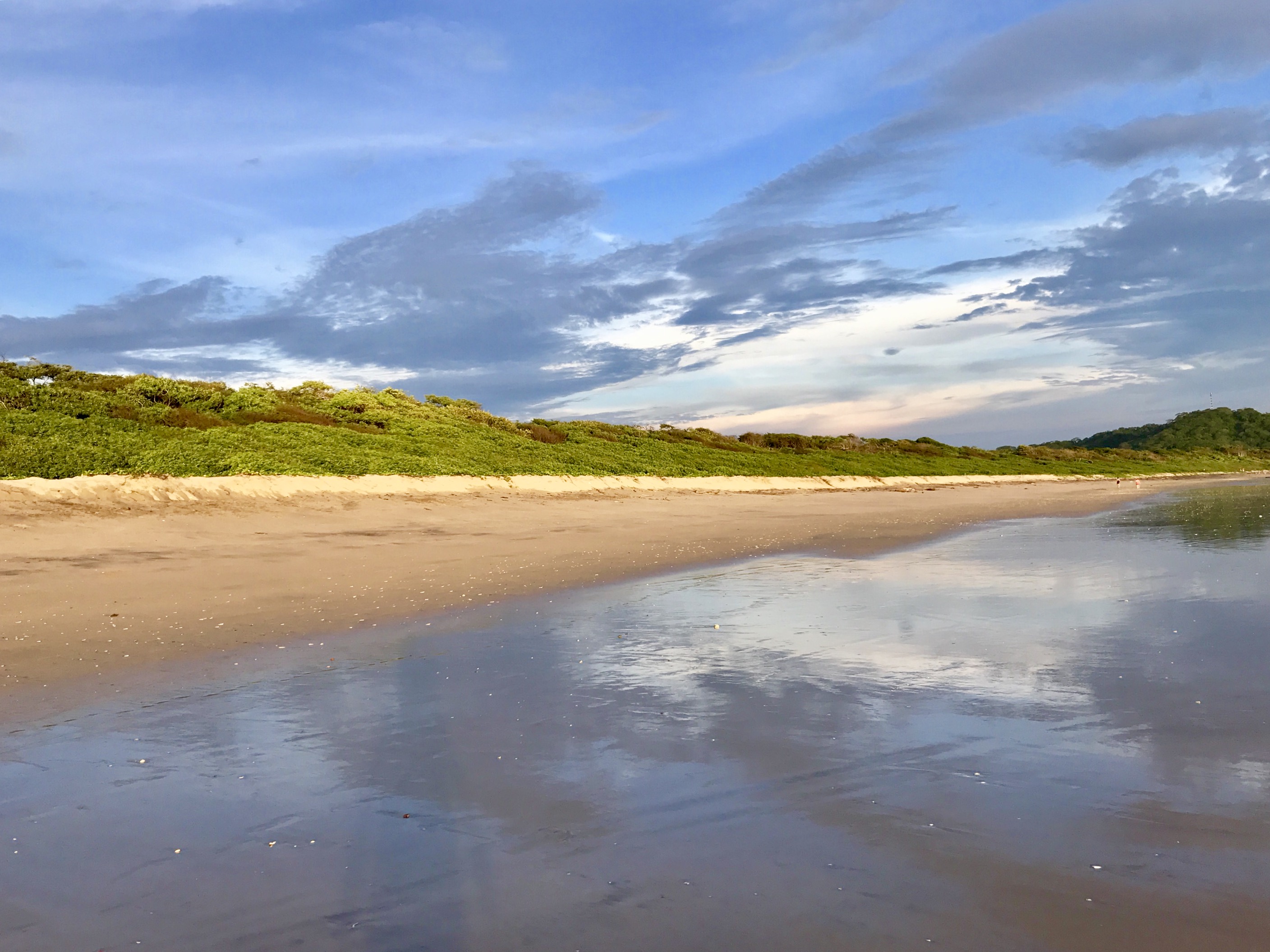 Clouds Reflecting on Beach